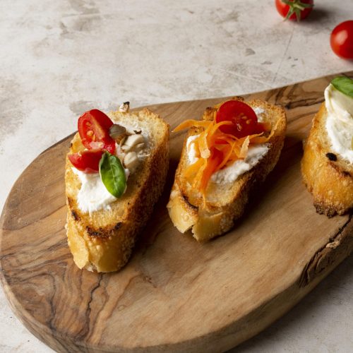 slices-bruschetta-wooden-board